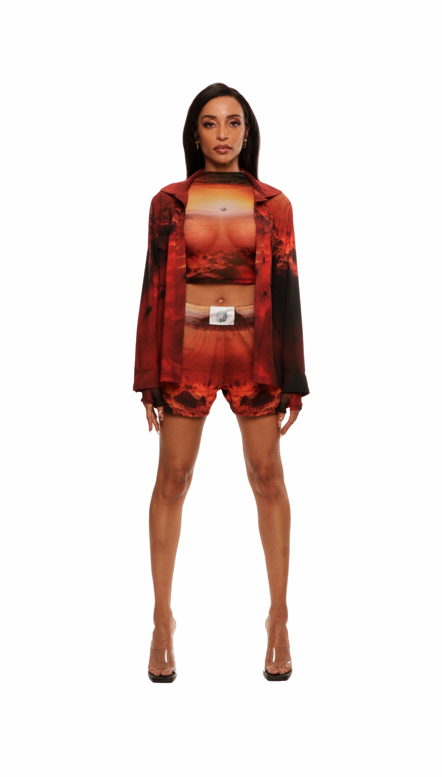 Woman who looks like Beyoncé or Aaliyah wears a cosmic Mars sunset printed long sleeve button up shirt with snaps, front view