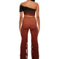 Woman who looks like Beyoncé or Aaliyah wears gradient brown toned asymmetrical top with clear strap, back view