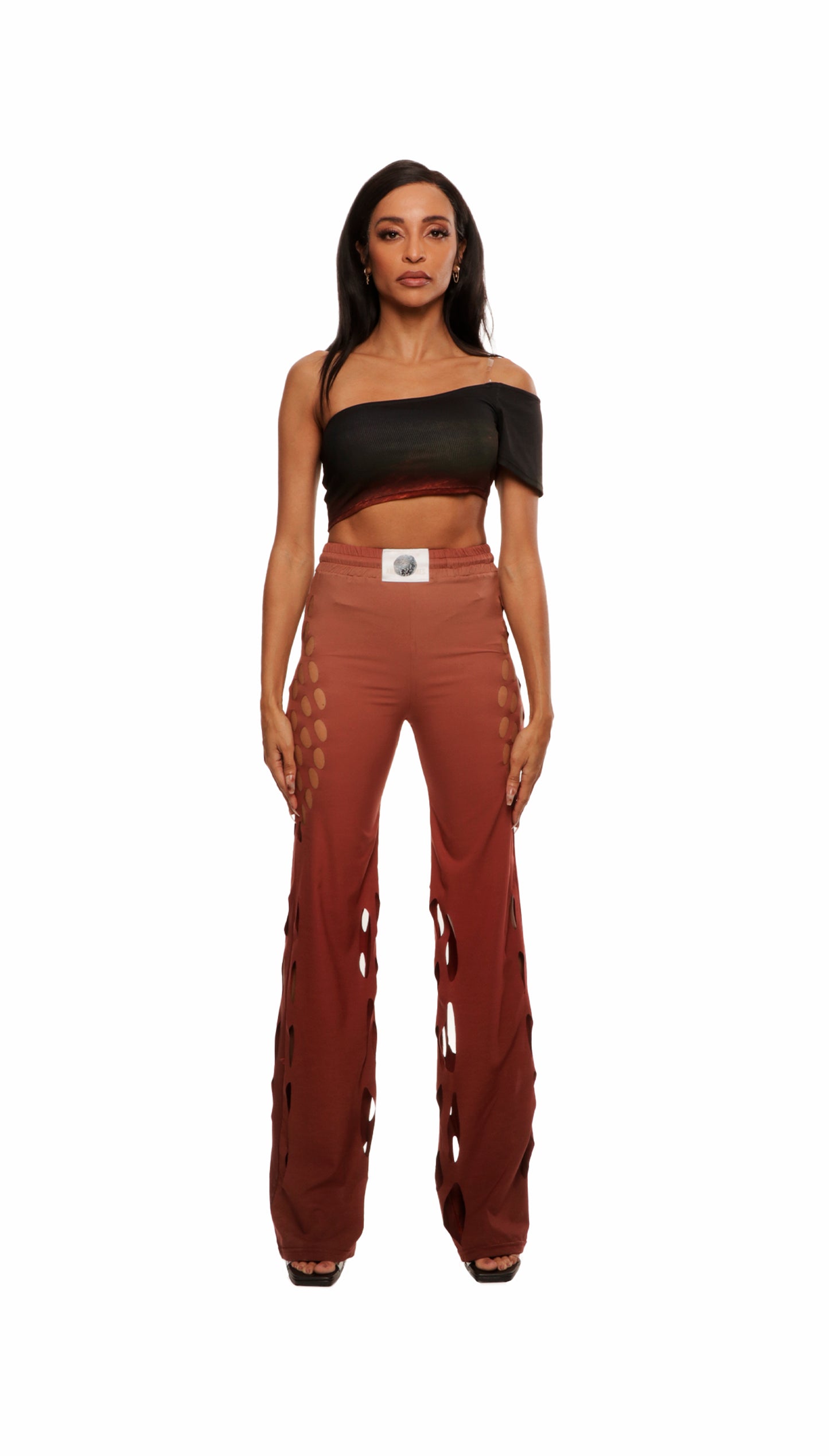 Woman who looks like Beyoncé or Aaliyah wears gradient brown toned asymmetrical top with clear strap, front view