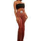 Woman who looks like Beyoncé or Aaliyah wears gradient brown toned bottoms or pants with cutout details on the sides, front view
