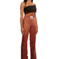 Woman who looks like Beyoncé or Aaliyah wears gradient brown toned bottoms or pants with cutout details on the sides, side view