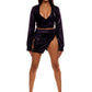 Woman who looks like Beyoncé or Aaliyah wears stretch cooling smooth nylon mini skirt with adjustable open detail clasp front paired with matching top, front view.