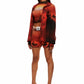 Woman who looks like Beyoncé or Aaliyah wears a cosmic sunset printed long sleeve button up shirt with snaps, side view