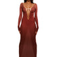 Woman who looks like Beyoncé or Aaliyah wears bodycon brown gradient printed stretch rib knit maxi dress with gauntlet sleeve detail and adjustable deep 'v' neckline. Front view.