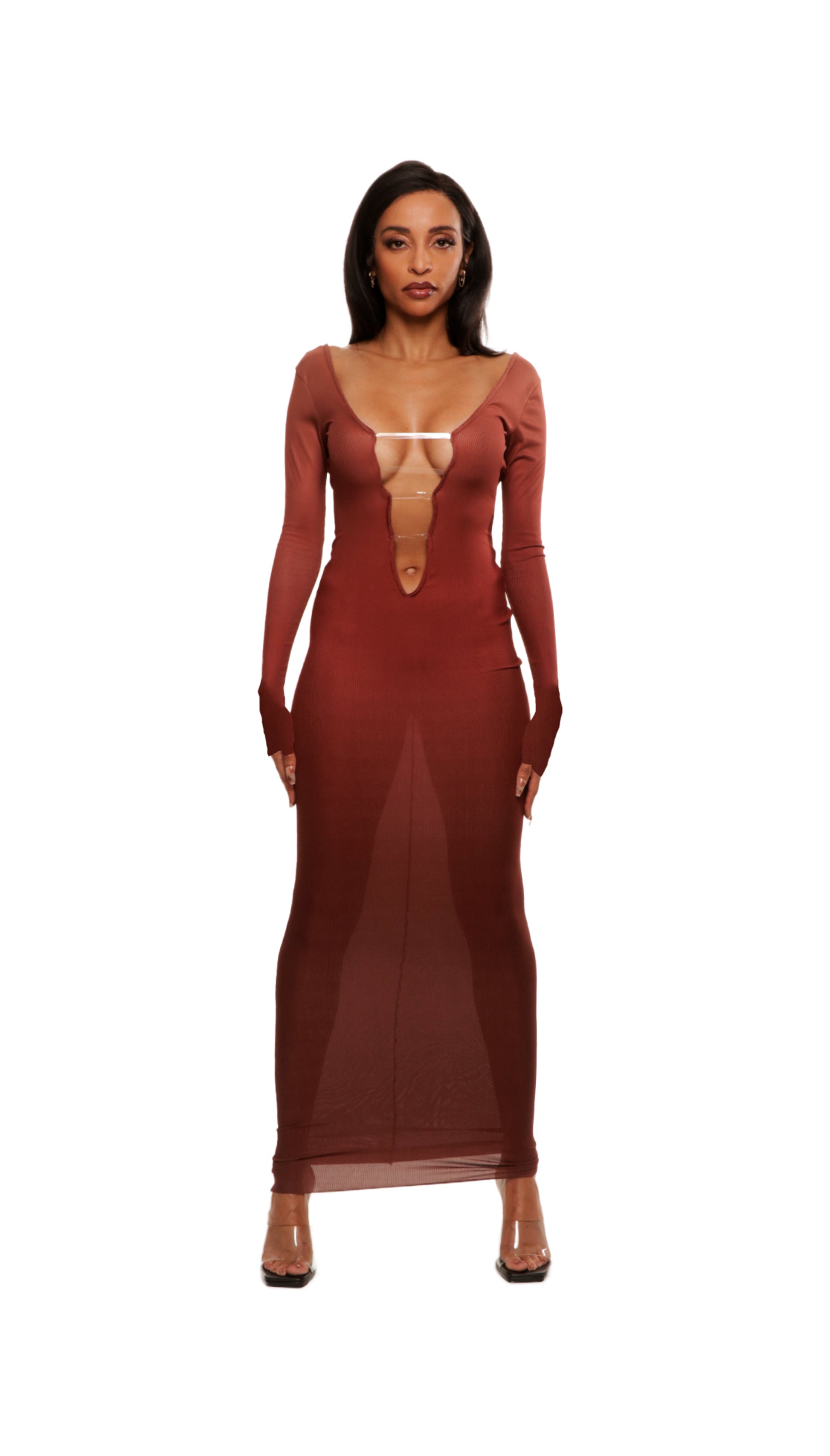 Woman who looks like Beyoncé or Aaliyah wears bodycon brown gradient printed stretch rib knit maxi dress with gauntlet sleeve detail and adjustable deep 'v' neckline. Front view.