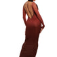 Woman who looks like Beyoncé or Aaliyah wears bodycon brown gradient printed stretch rib knit maxi dress with gauntlet sleeve detail and adjustable deep 'v' neckline, back view.