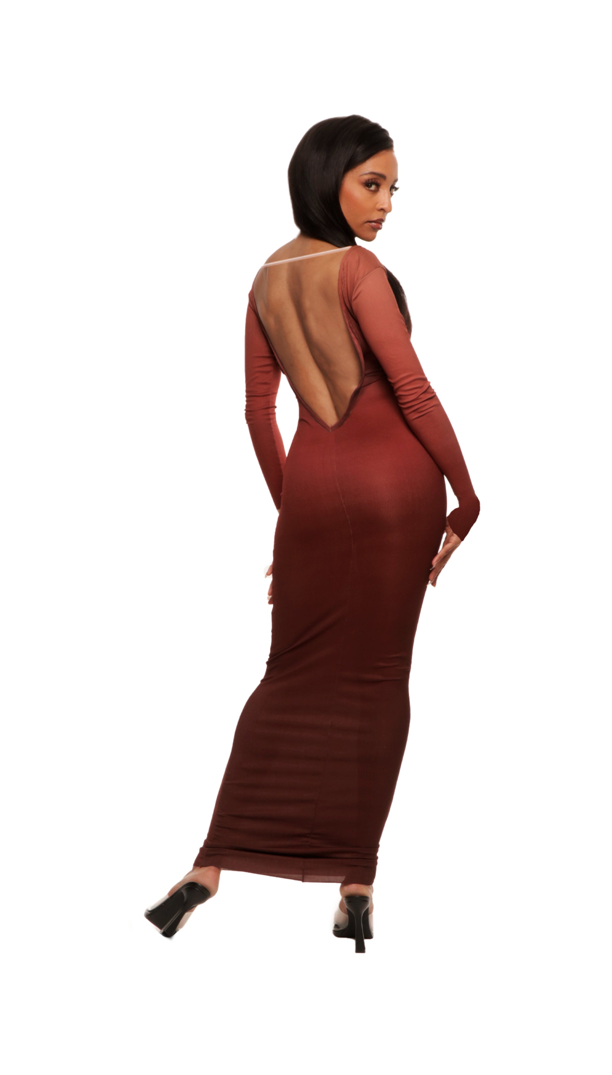 Woman who looks like Beyoncé or Aaliyah wears bodycon brown gradient printed stretch rib knit maxi dress with gauntlet sleeve detail and adjustable deep 'v' neckline, back view.