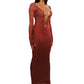 Woman who looks like Beyoncé or Aaliyah wears bodycon brown gradient printed stretch rib knit maxi dress with gauntlet sleeve detail and adjustable deep 'v' neckline. Right view.