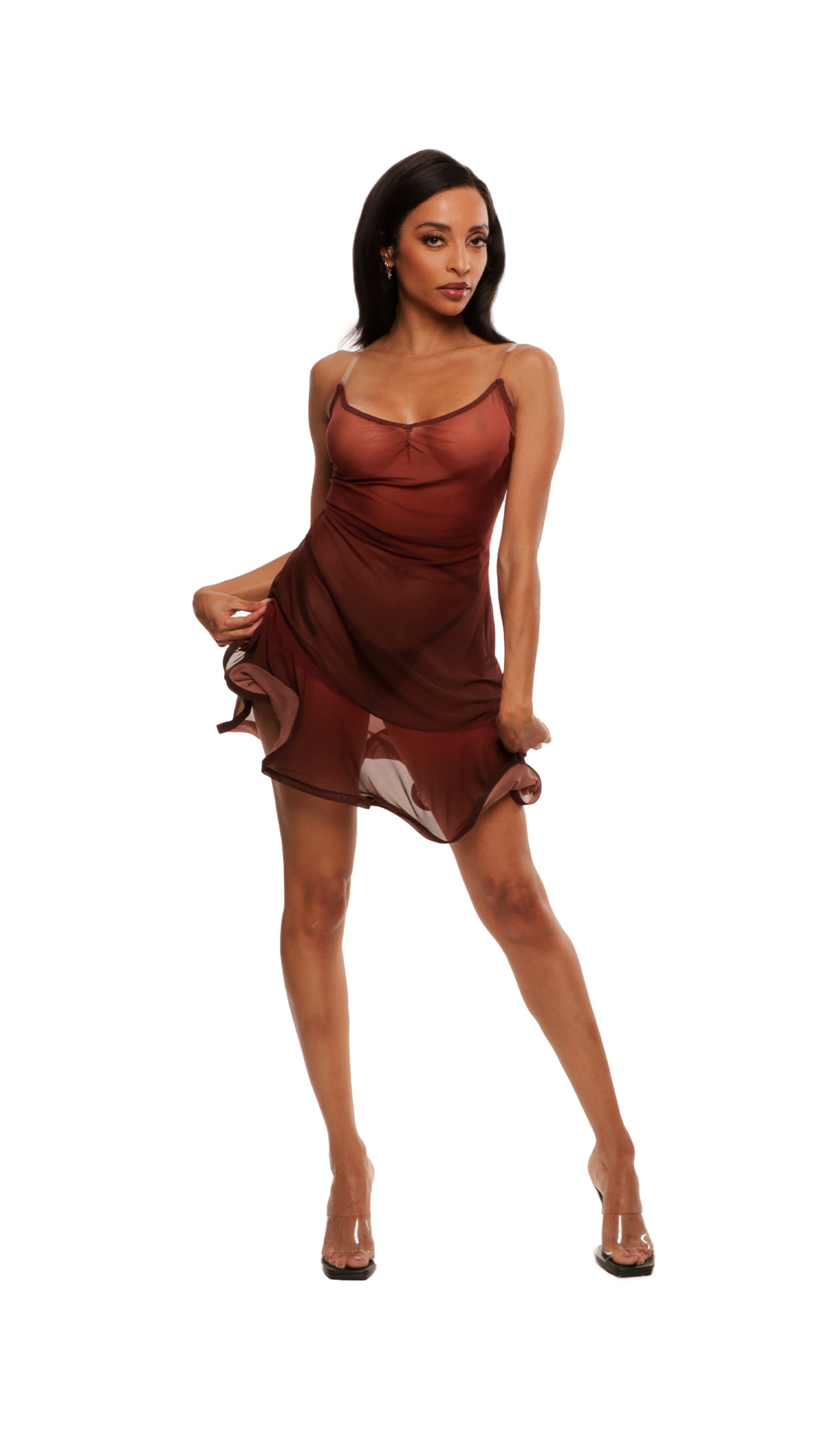 Woman who looks like Beyoncé or Aaliyah wears a stretch sheer gradient printed mesh dress with flirty ruffle hemline. Front view.