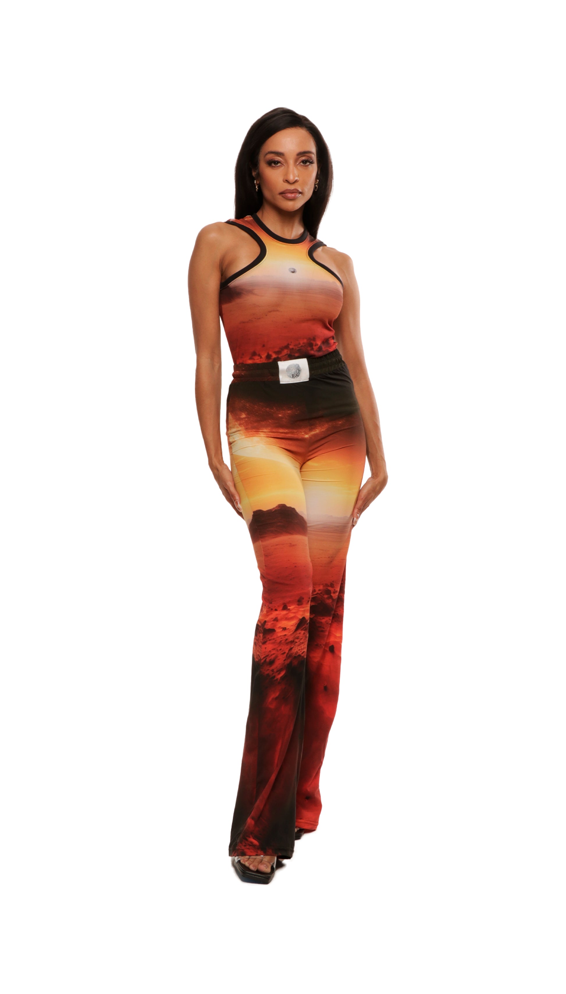 Woman who looks like Beyoncé or Aaliyah wears cosmic Mars sunset printed wide leg pant, front view 