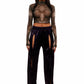 Woman who looks like Beyoncé or Aaliyah wears a grey stretch mesh long sleeve top custom printed to contour the body and resemble an oil spill. Front view paired with shiny purple pants.