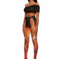Angle view of woman who looks like Beyonce or Aaliyah wears sunset printed jersey leggings with cutout details in the front attached with snaps and heel cutout