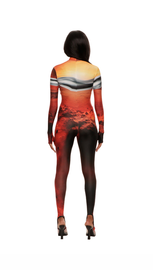 Woman wears Mars sunset print wetsuit or catsuit with chrome detail across chest and QR logo with heel cutout and back zipper