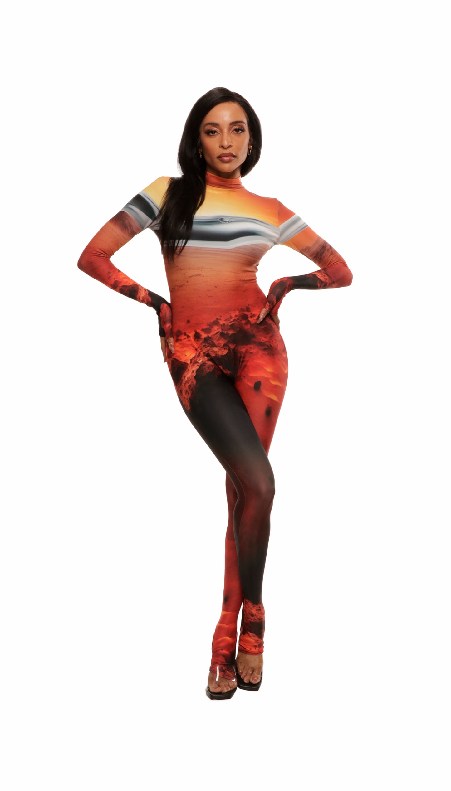 Woman wears Mars sunset print wetsuit or catsuit with chrome detail across chest and QR logo with heel cutout